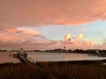 Scenic view of beach against sky during sunset