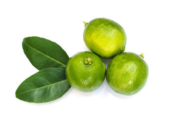 Close-up of apples on green background