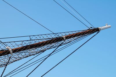 Low angle view of mast against clear blue sky