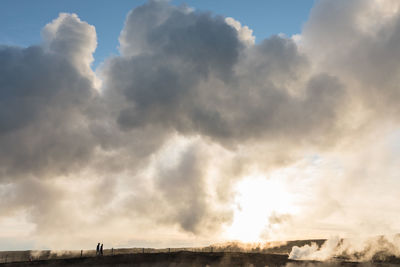 Scenic view of clouds over landscape against sky