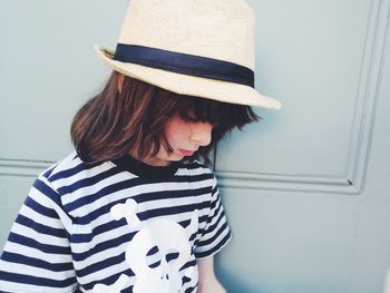 Portrait of girl wearing hat at home