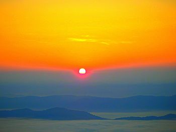 Scenic view of dramatic sky over sea during sunset