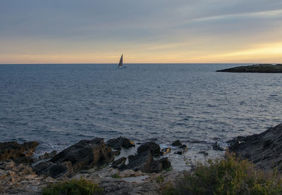 Scenic view of sea against sky during sunset