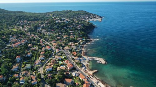 High angle view of townscape by sea