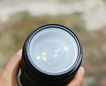 Cropped image of person holding camera