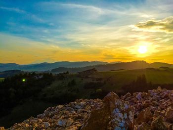 Scenic view of mountains at sunset