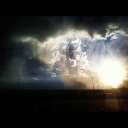 Scenic view of landscape against cloudy sky