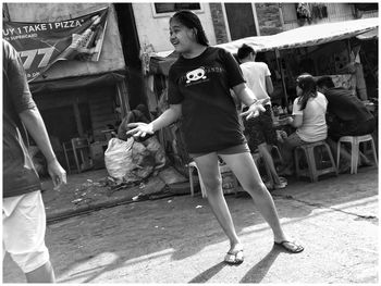 Full length of woman standing outdoors