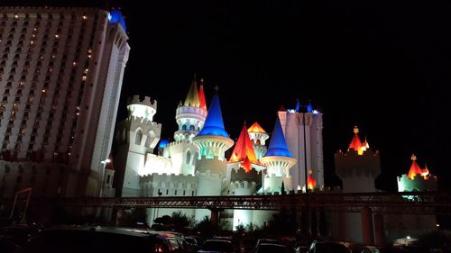 Low angle view of illuminated buildings at night