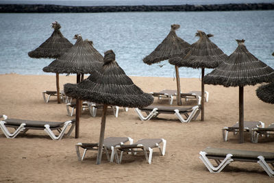 Lounge chairs and tables at beach