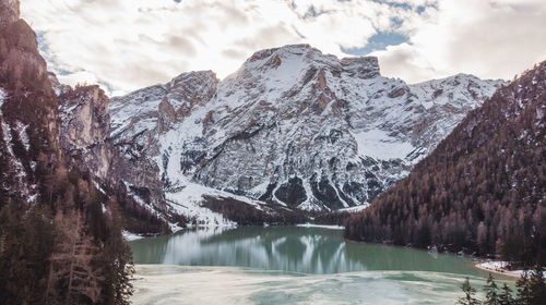 Scenic view of lake and snowcapped mountains during winter