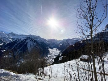 Scenic view of snowcapped mountains against sky