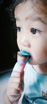 Portrait of cute girl holding ice cream