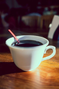 Close-up of coffee cup on table