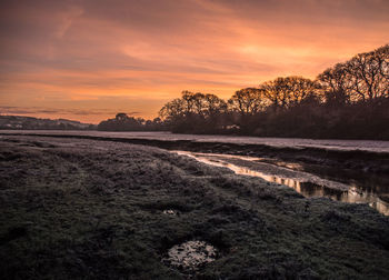 Scenic view of landscape against sky during sunset