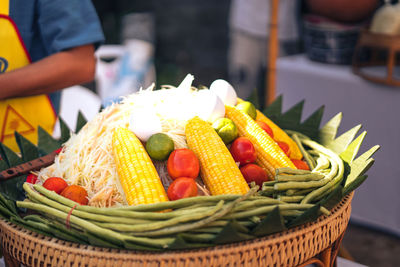 Close-up of fruits in basket for sale at market stall