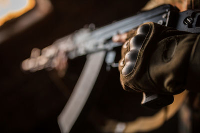 Portrait of serious middle eastern man with ak-47