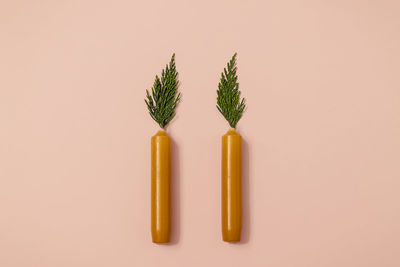 Close-up of beauty products against pink background