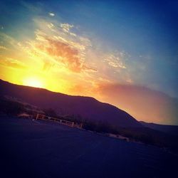 Scenic view of mountains at sunset