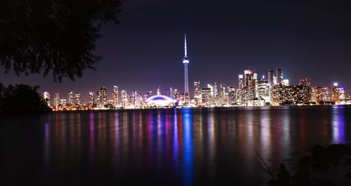 Illuminated buildings in city at night