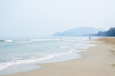 Scenic view of beach against clear sky