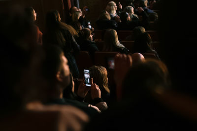 Blurred motion of people at music concert