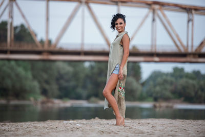 Portrait of young woman standing outdoors