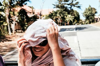 Portrait of a smiling young woman in car