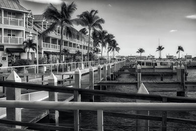 Swimming pool by building against sky