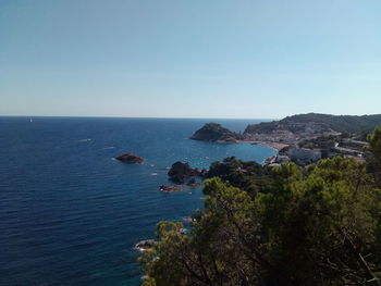 Scenic view of sea against clear blue sky