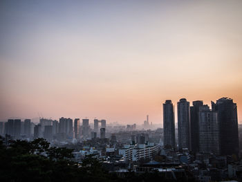 View of cityscape against sky during sunset