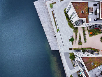 High angle view of swimming pool by buildings in town