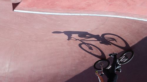 High angle view of person riding bicycle on street