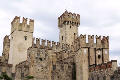 Low angle view of old ruins against sky