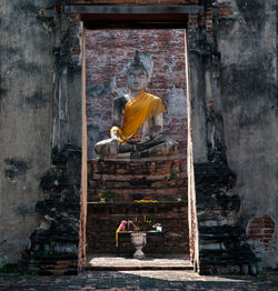 Statue of buddha outside building