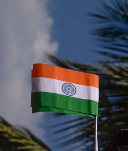 Low angle view of indian flag against sky