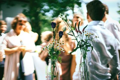 Rear view of people on flower