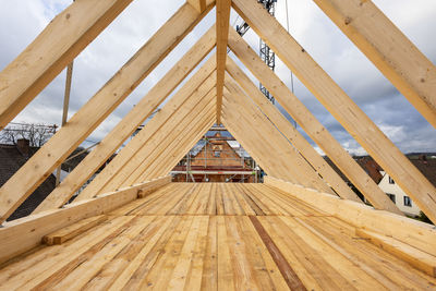 Low angle view of roof against sky