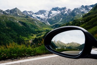 Scenic view of mountains seen through car windshield