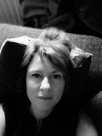 Portrait of young woman lying down