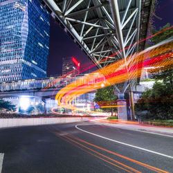 Light trails on road in city at night