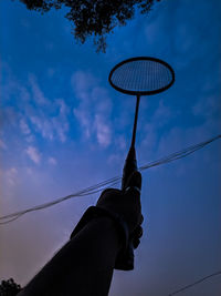 Low angle view of silhouette basketball against sky at sunset