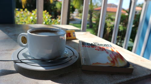 Close-up of coffee cup on table