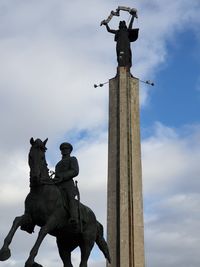 Low angle view of statue against sky