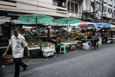 People at street market in city