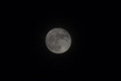 Low angle view of moon against sky at night