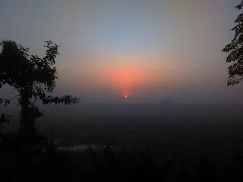 Scenic view of silhouette landscape against sky during sunset