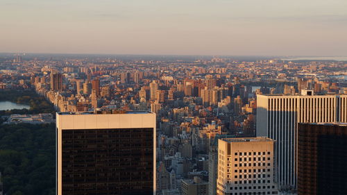 High angle view of modern buildings in city against sky