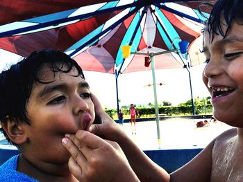 Close-up portrait of smiling young woman
