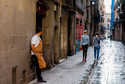 People walking on road in city